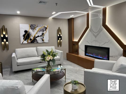 Interior common area with modern seating and fireplace