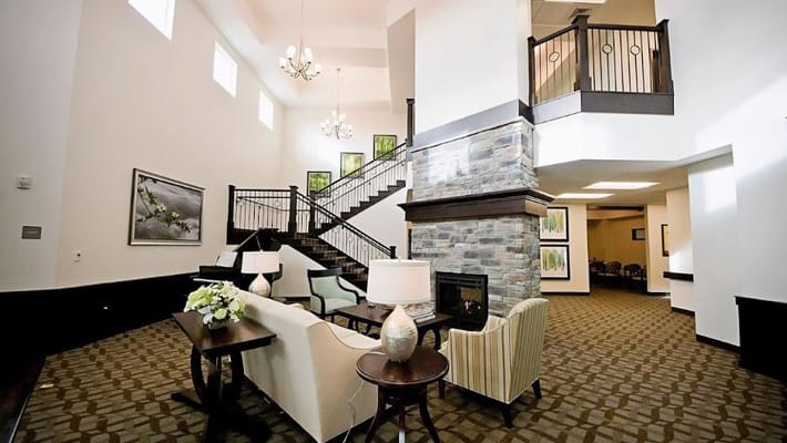 Spacious lobby area with stairs and seating