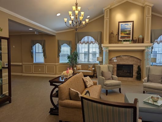 Inviting living room with seating and a fireplace
