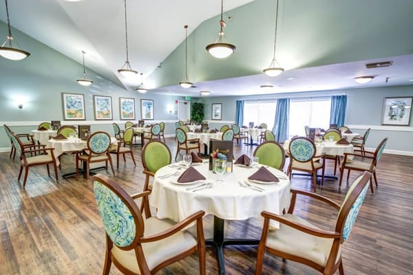 Elegant dining room with tables set for meals