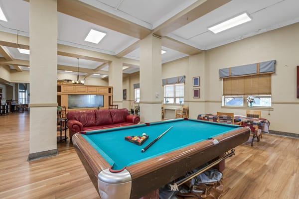 Pool table in the recreation room with seating area