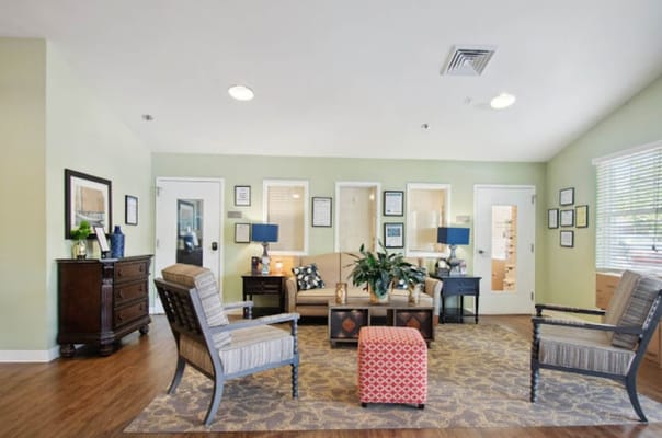 Comfortable seating area with a sofa and two chairs in a lounge setting