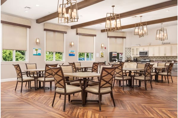 Bright dining area with tables and chairs at Spring Oak at Vineland