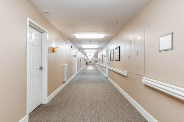 Interior hallway with doors and artwork.