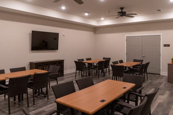 Interior view of a common area with tables and chairs