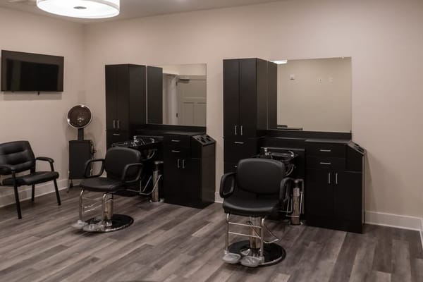 Interior view of the hair salon with styling chairs and mirrors