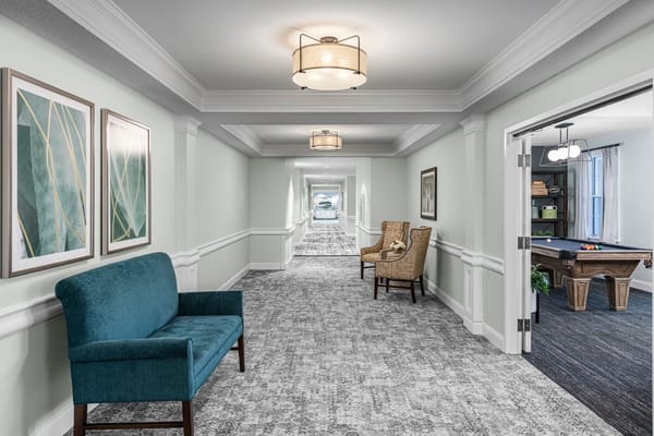 Wide hallway with seating and art decor