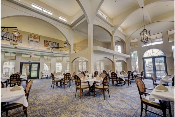Spacious dining room with tables and chairs at The Garnet of Casa Grande
