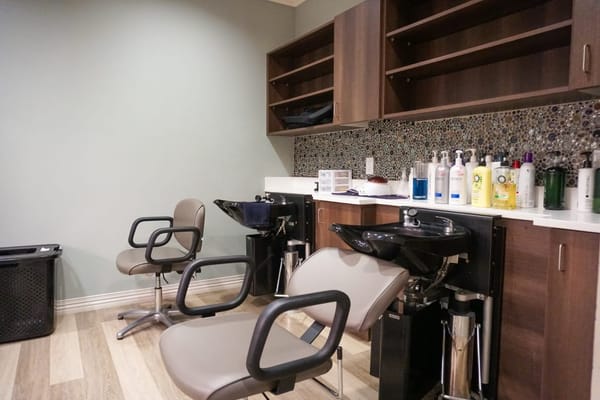 Salon chairs and shampoo station in a senior living facility