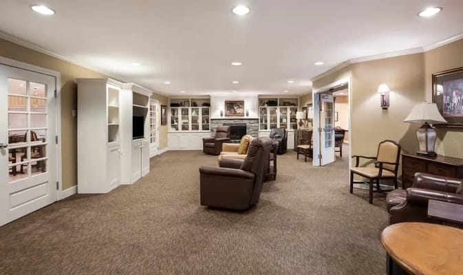 Front entrance of The Hampton Memory Care Community at dusk