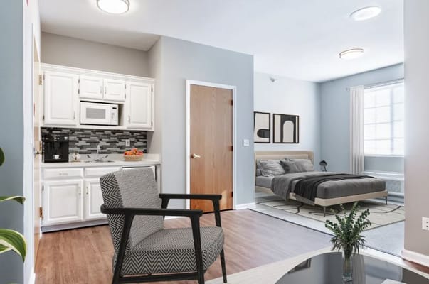 Interior view of an apartment in Trustwell Living Mission Springs with kitchen and bedroom.