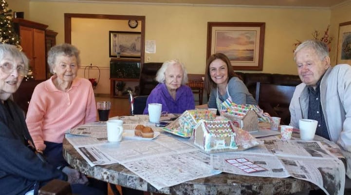 Residents and staff enjoying crafting decorations