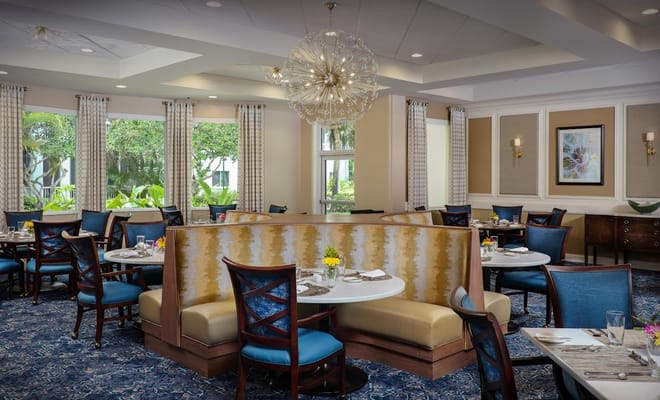 Bright dining area with tables set for meals