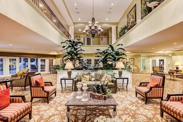 Interior view of a common area with seating and plants