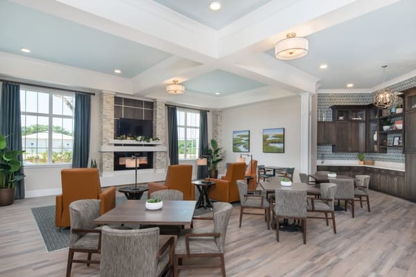 Comfortable lounge area with seating and a fireplace.