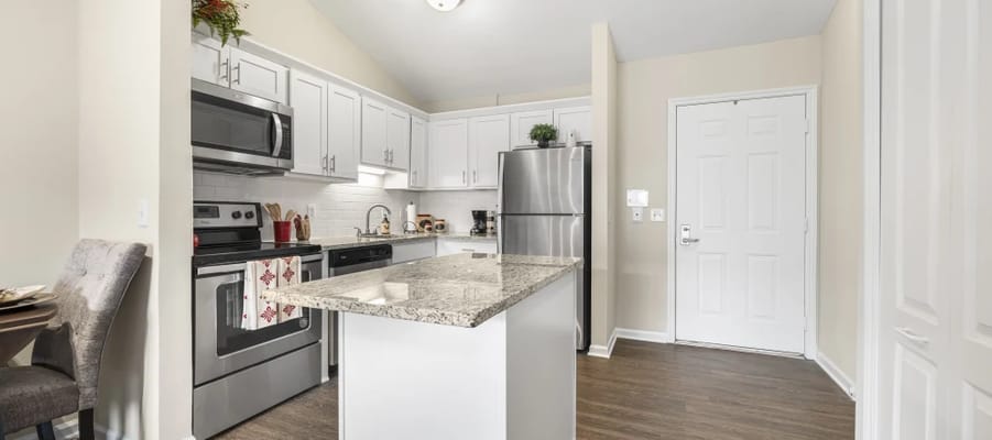 Bright kitchen with modern appliances and granite countertops