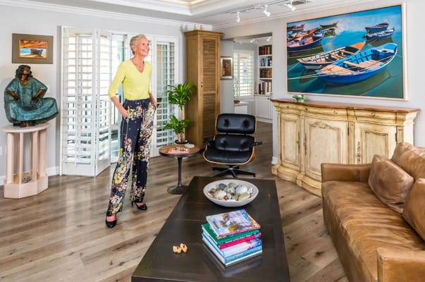 Resident standing in a beautifully decorated living room
