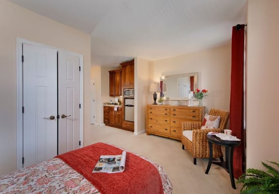 Cozy resident room with a bed and seating area