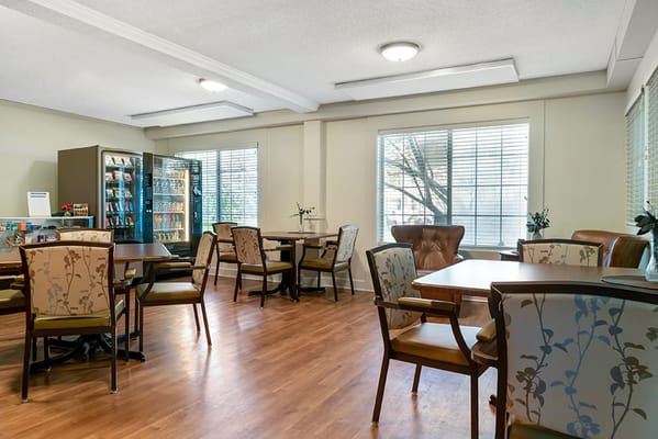 Bright common area with tables and chairs