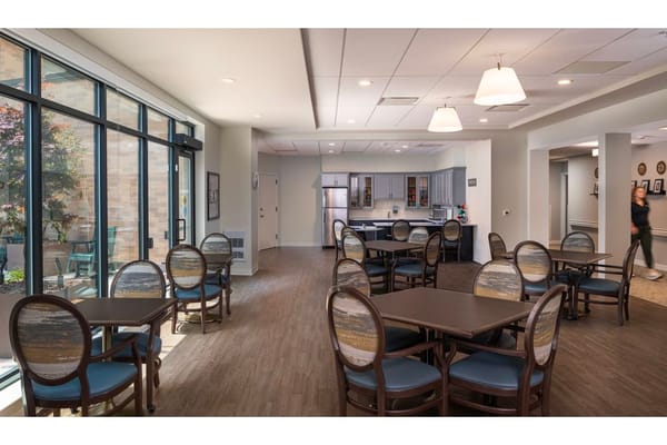 Bright dining area with tables and chairs