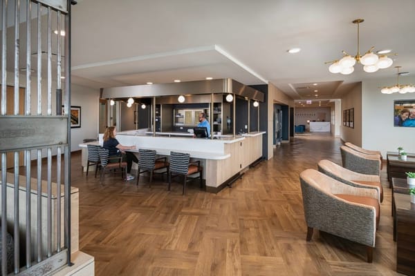 Interior common area with seating and staff