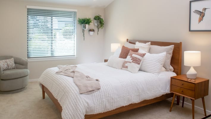 Bright and cozy bedroom setup in a senior living facility
