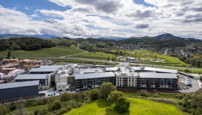 Aerial view of Enso Village surrounded by green hills