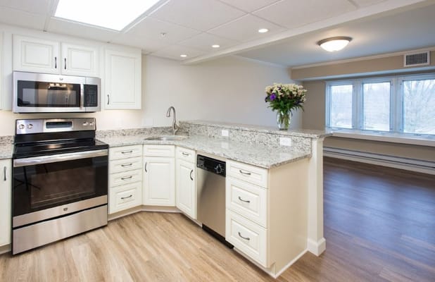 Modern kitchen with stainless steel appliances and granite countertops
