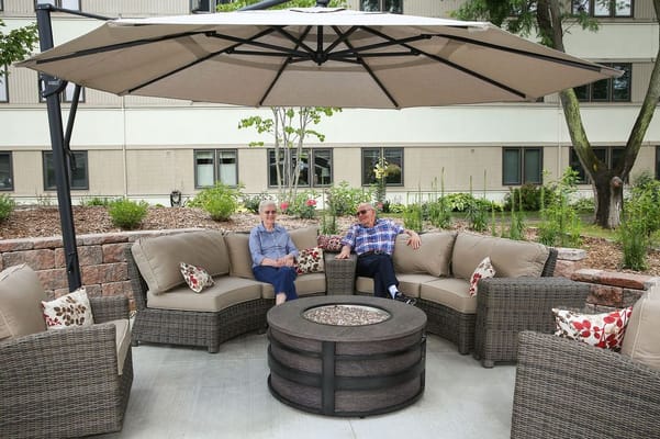 Residents enjoying a relaxing moment in an outdoor seating area