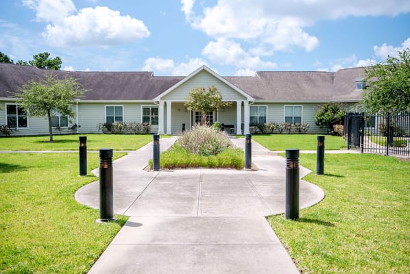 Path leading to the entrance of The Reserve at Katy with landscaping