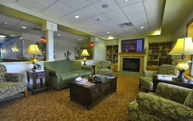 Cozy common area with seating and a fireplace
