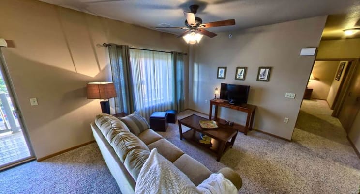 Cozy living room area with a couch and TV