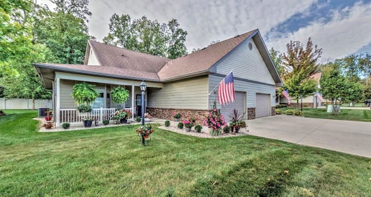 Exterior view of the facility with landscaped gardens