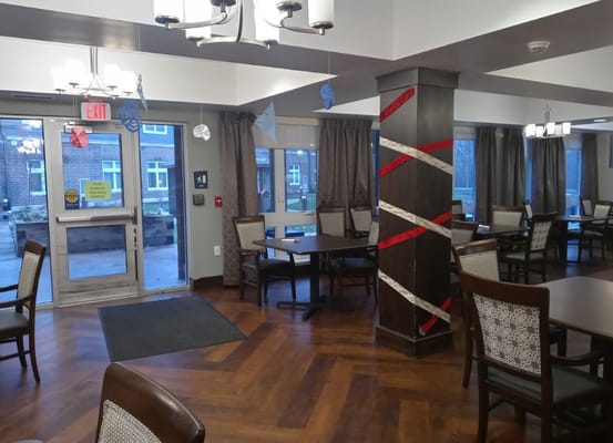 Interior view of the dining area with tables and decorative elements.