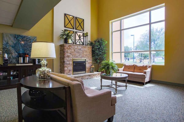 Bright living room with a fireplace and seating area