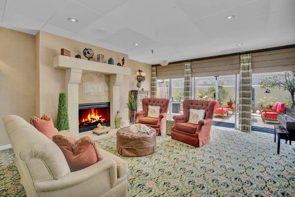 Cozy common area with a fireplace and seating