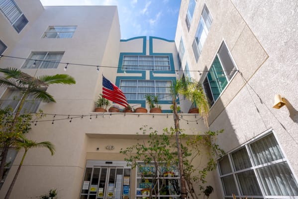 Outdoor view of facility entrance with American flag