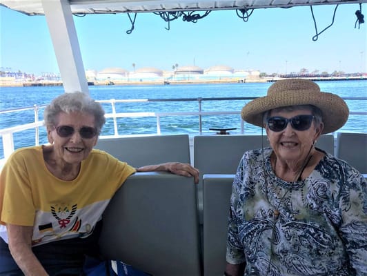 Two smiling residents on a boat trip