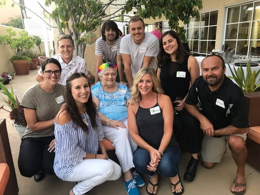 Residents and staff enjoying a social event outdoors
