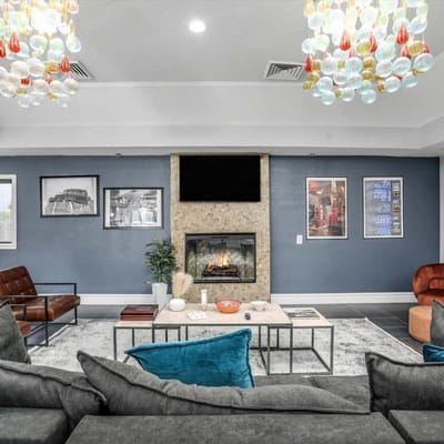 A cozy common area with a fireplace and seating