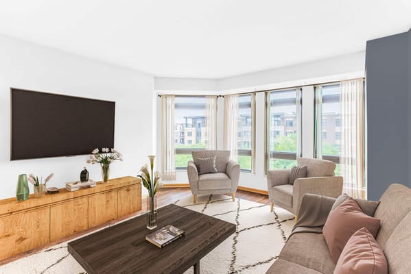 Bright common area with seating and large windows