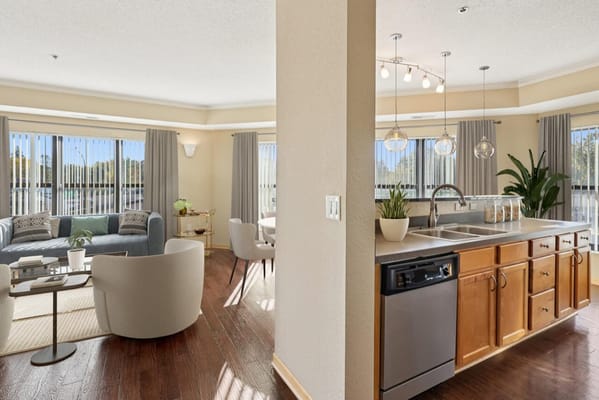 Bright common area with seating and kitchenette