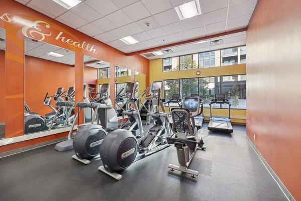 Bright fitness room with exercise equipment