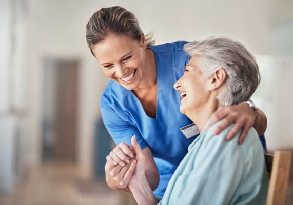 Staff interacting with a resident in a care facility