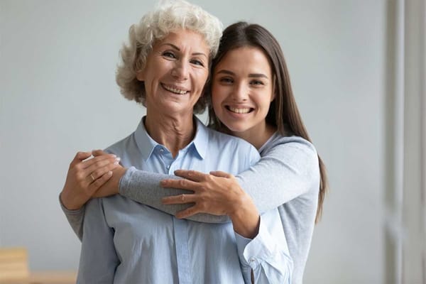 Two women smiling, showcasing companionship