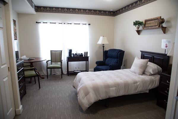 Cozy single resident room with bed and furnishings