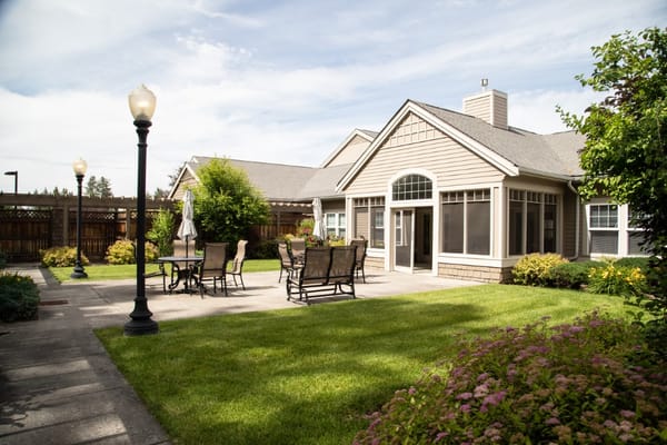 Outdoor patio area with seating and landscaping