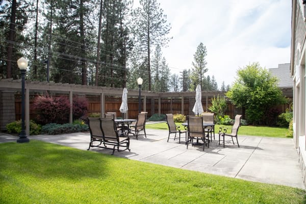 Outdoor patio area with seating and umbrellas