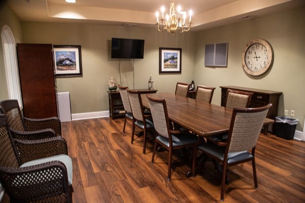Conference room with a long table and chairs