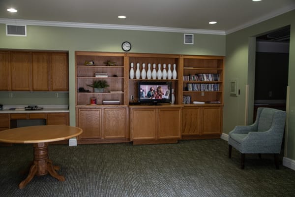 Interior view of a common area with furniture and TV